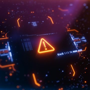 Warning icon on a digital LCD display with reflection. Les risques hypothétiques de l’intelligence artificielle